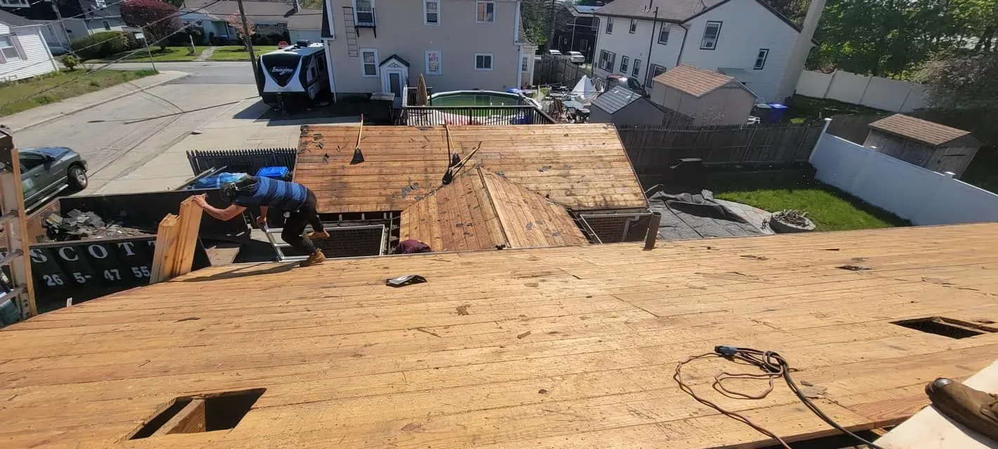 A roof is being repaired in a residential neighborhood.