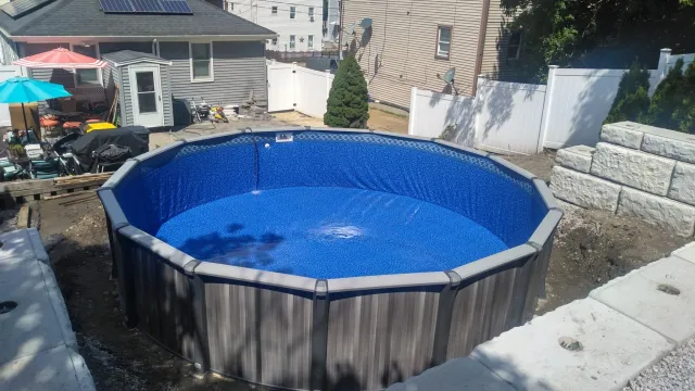 above ground pool installation, retaining wall