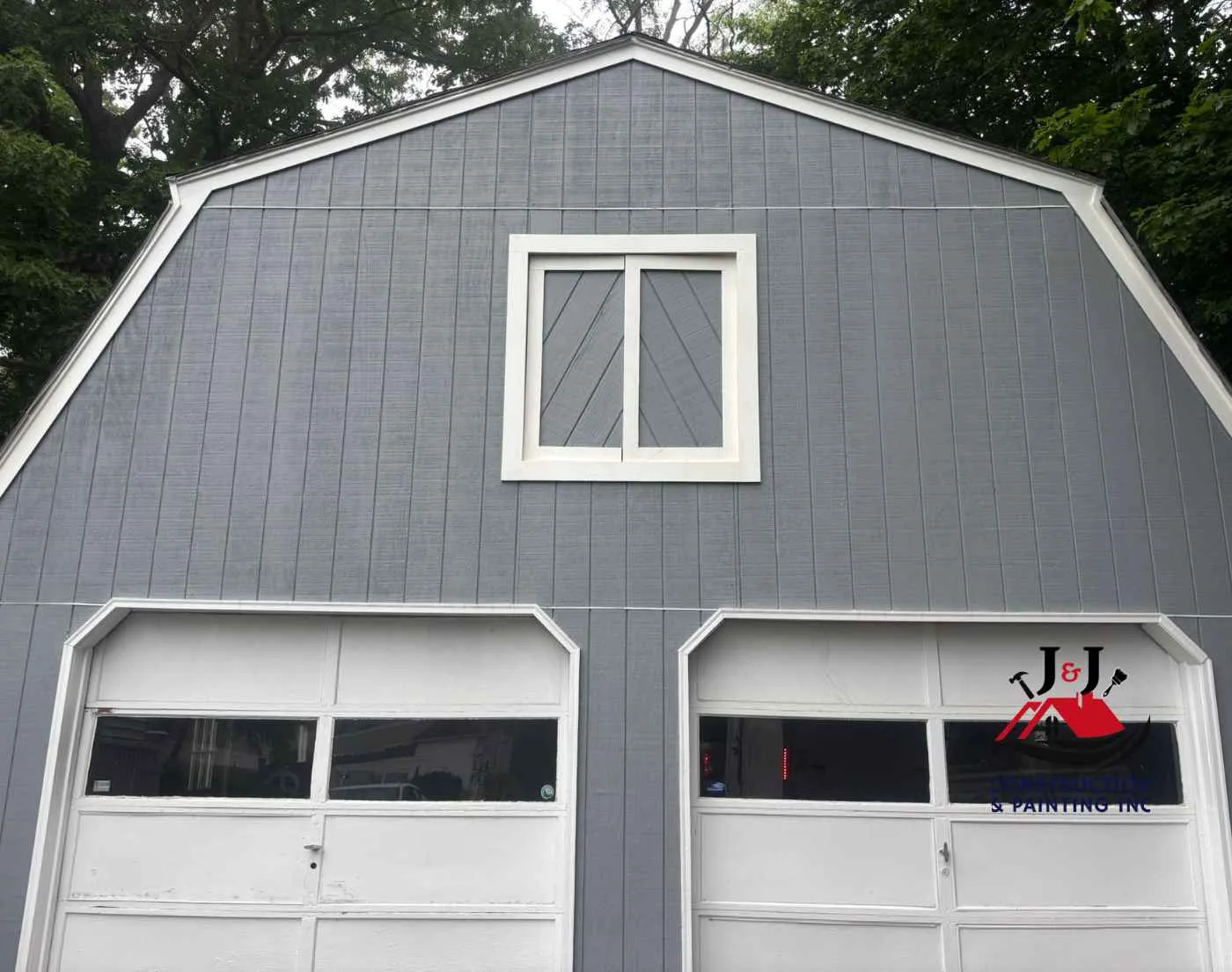 Repainted garage exterior with fresh trim