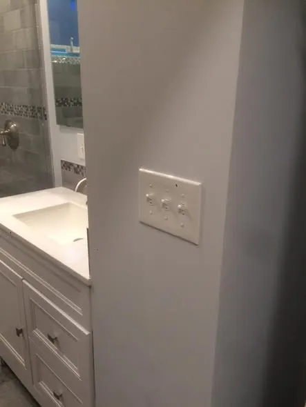 Switch bank installation in renovated bathroom