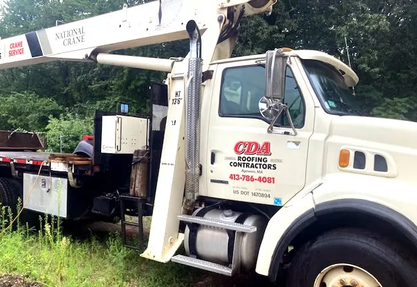 CDA Roofing crew working on a residential roof in Western Massachusetts