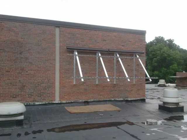 A brick building with a row of windows on the side