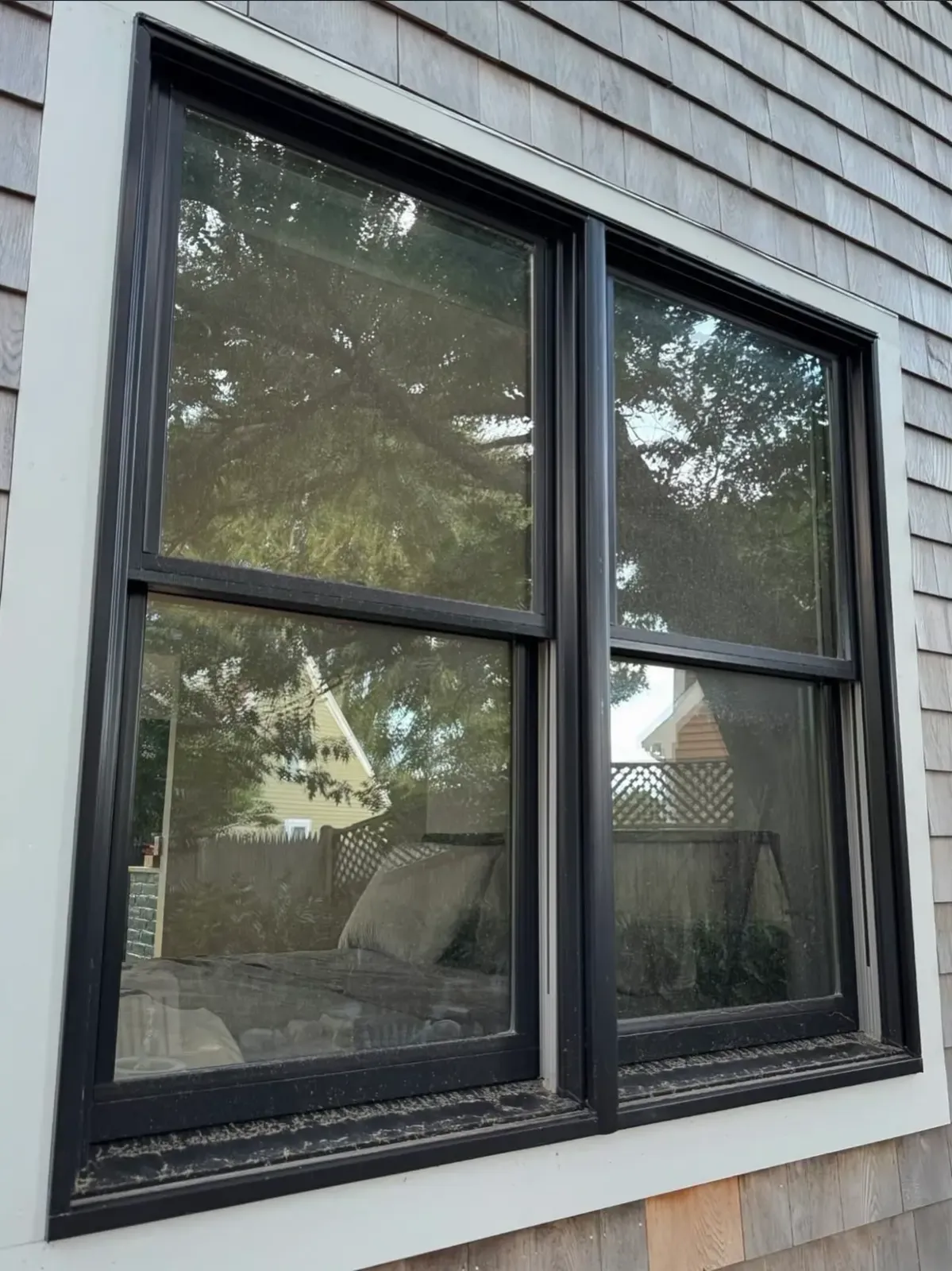 Before photo of dirty windows of a residential home