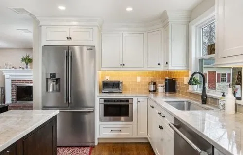Bright white kitchen with refinished cabinets