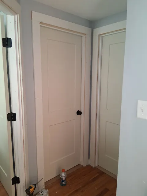 Newly hung interior doors in a finished hallway