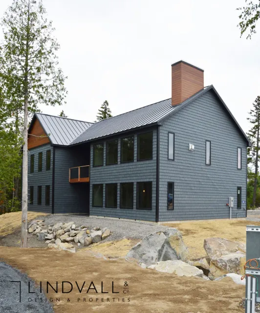 outside of large house with blue siding