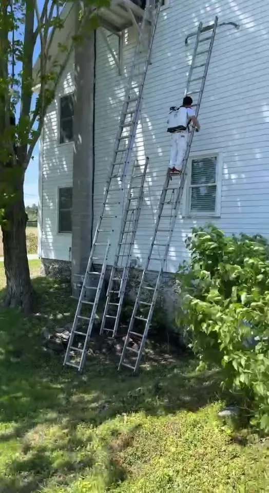 Facebook video poster: crew prepping siding on ladders