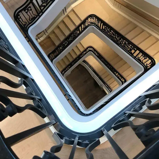 intricate metal scrollwork railing