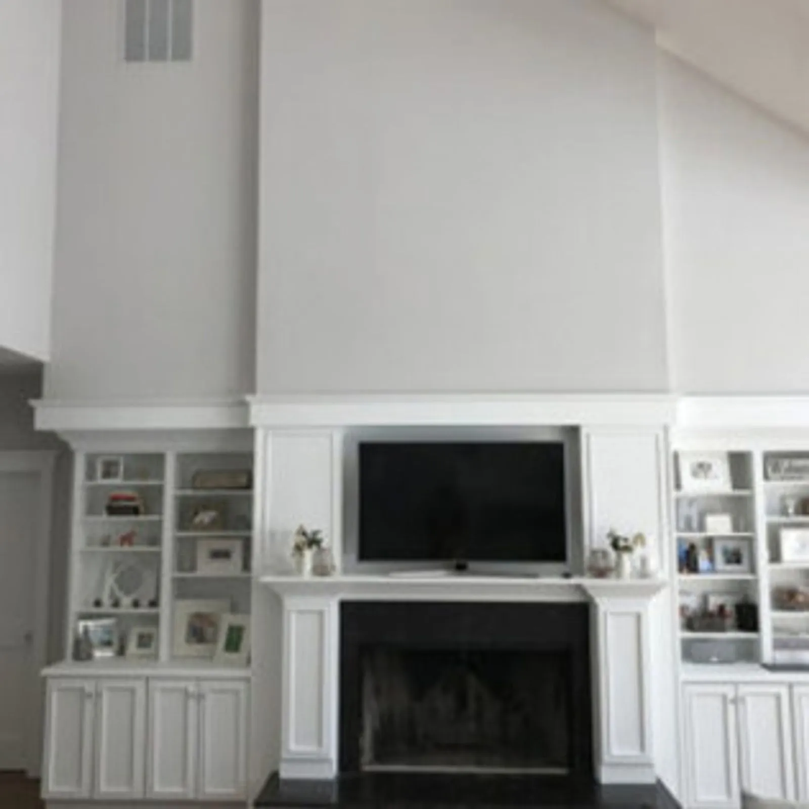 Living room built-ins and fireplace surround painted