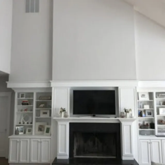 Living room built-ins and fireplace surround painted