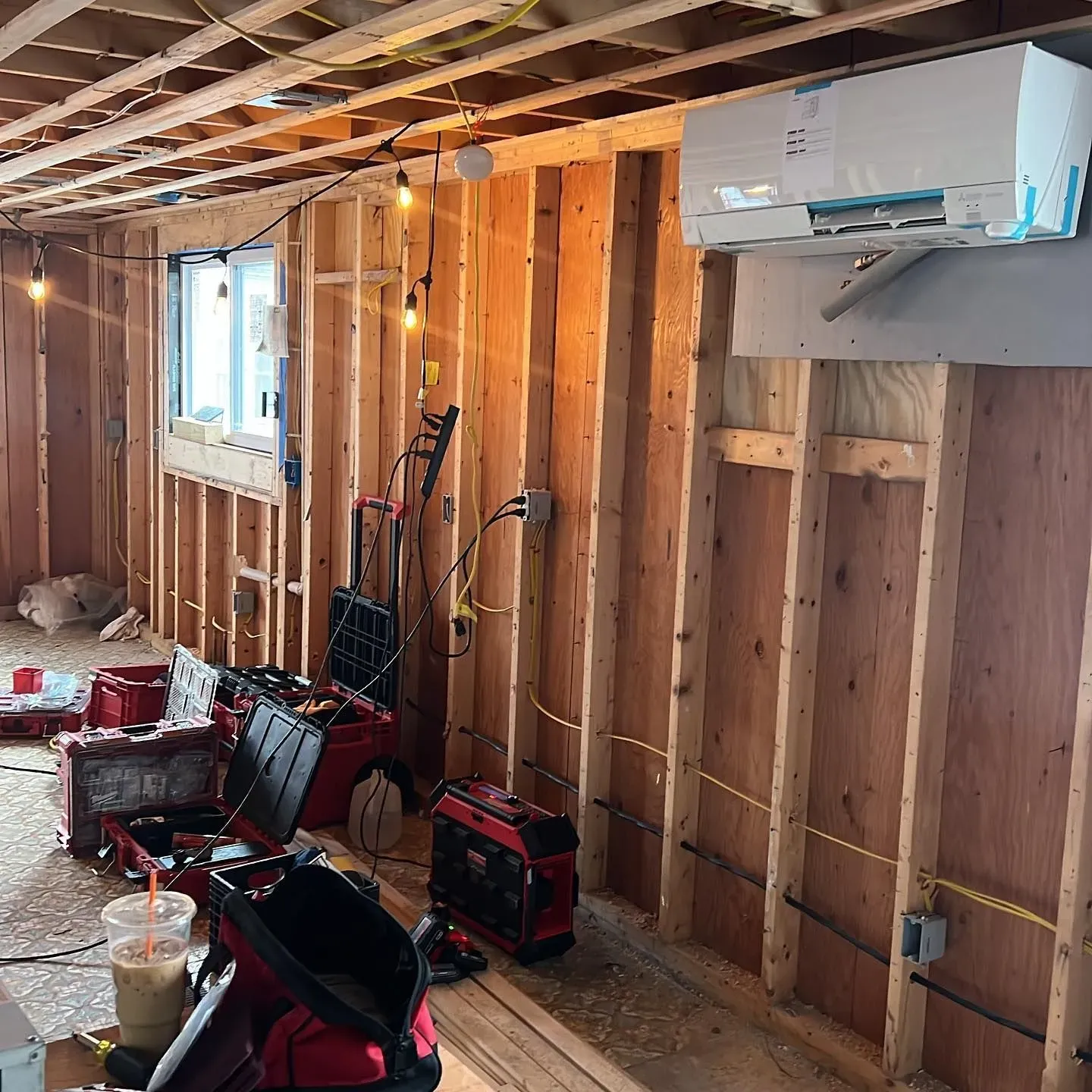 A room that is being built with a lot of wood and tools