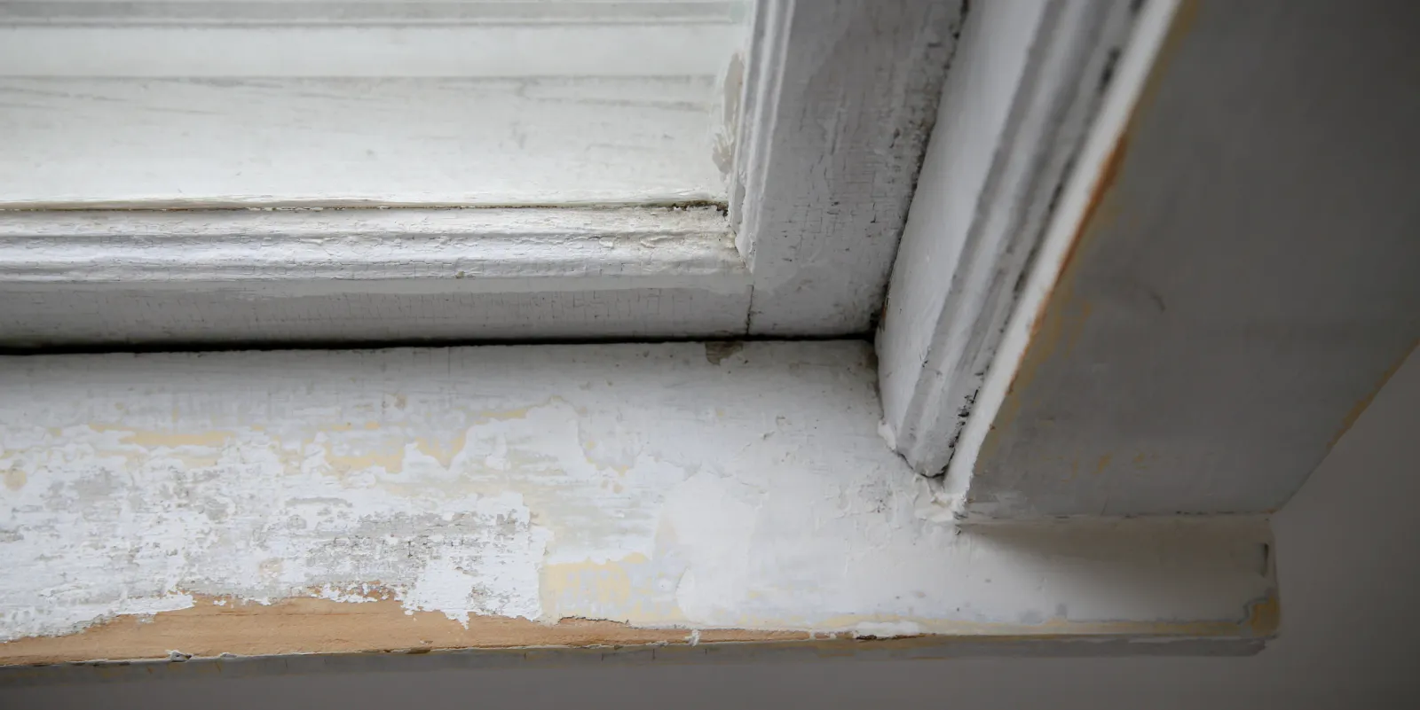 a deteriorated lead paint on the window sill