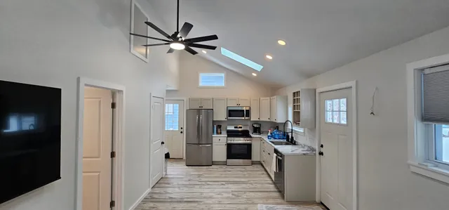 ADU kitchen with vaulted ceiling and modern finishes