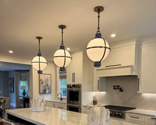 Kitchen with globe pendant fixtures over the island