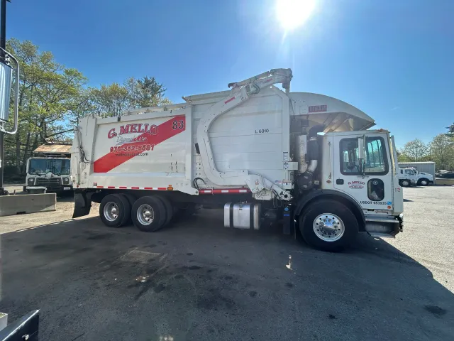 G. Mello branded truck servicing a commercial route
