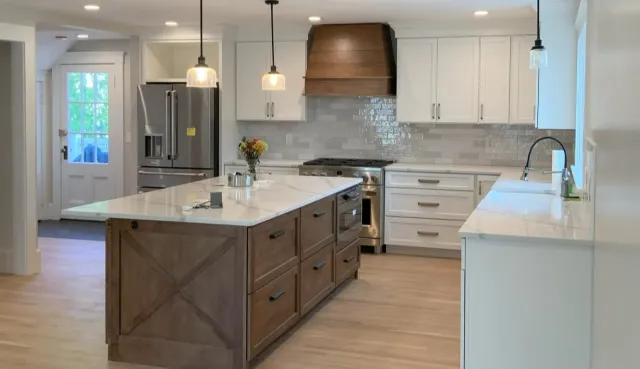rustic wood and white kitchen with island and pendant lights in Greater Boston, MA by Honorato Company