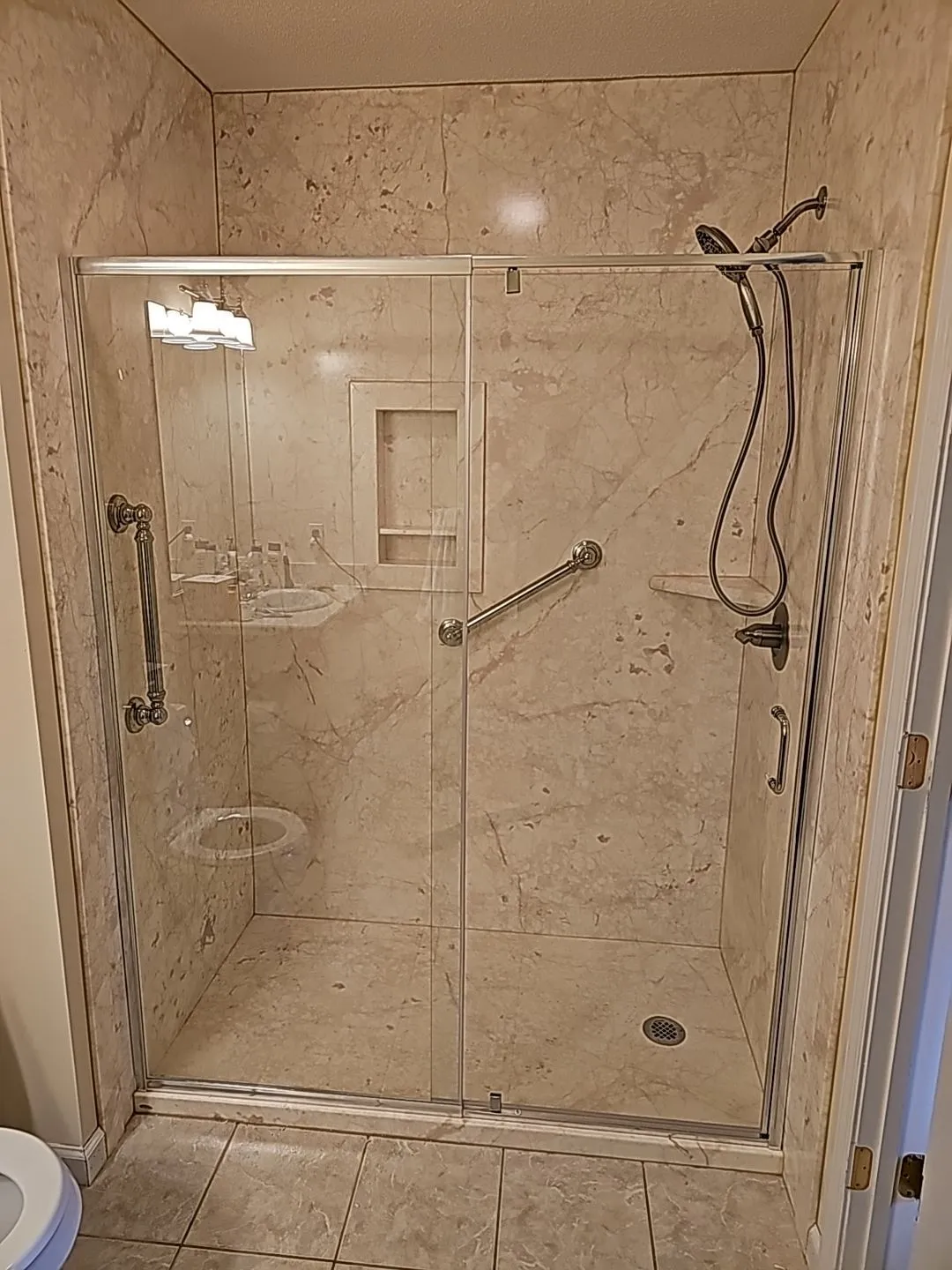 Frameless glass shower enclosure bathroom remodel