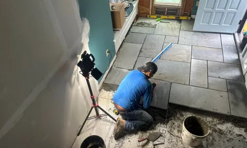Professional Painter Using A Brush to Paint House Fascia