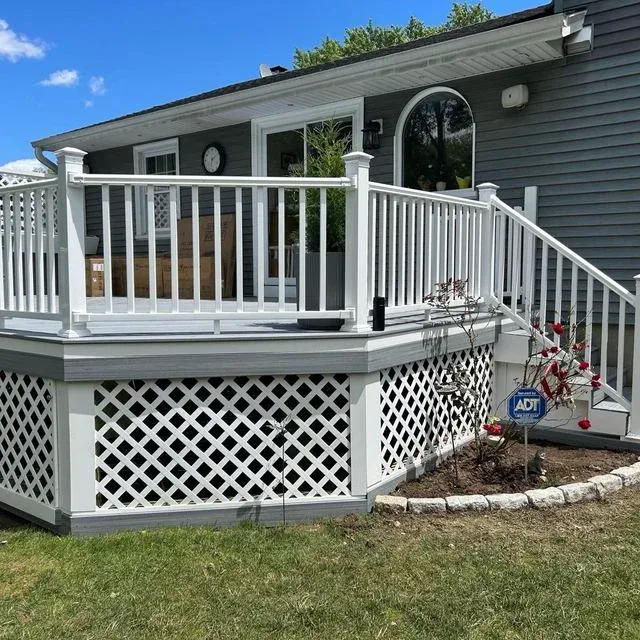 White guardrail and railing installation on a deck