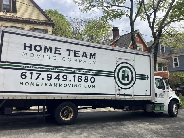 Home Team box truck staged outside a residential move