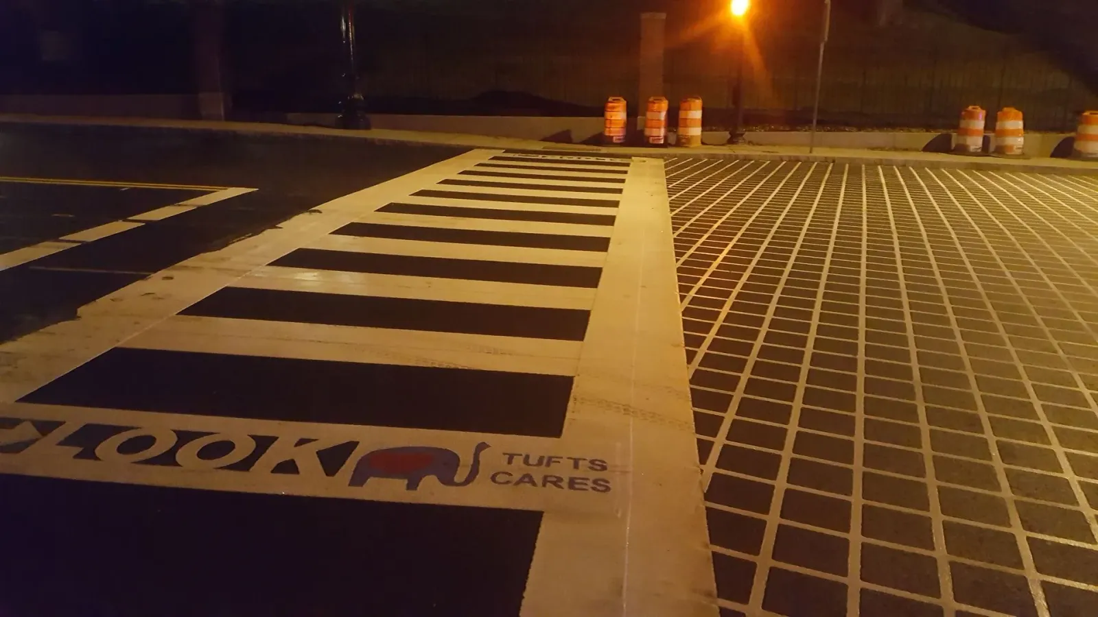 A crosswalk with a sign that says ' i love you ' on it
