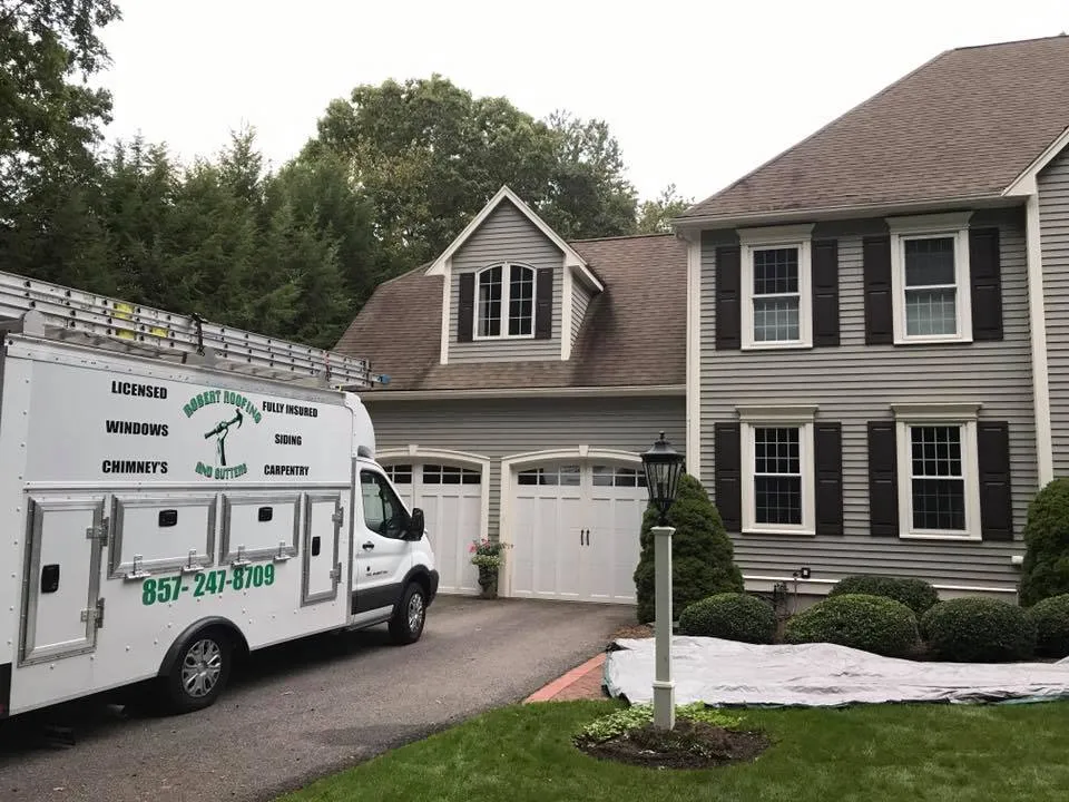 Branded truck at a residential roofing job