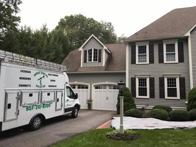 Branded truck at a residential roofing job