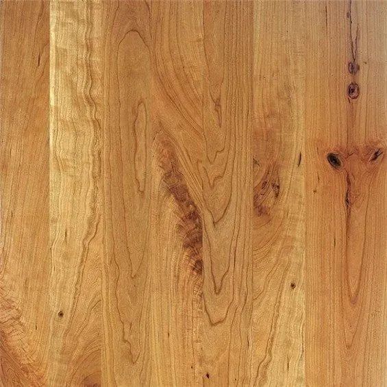 Wood flooring with varying shades of brown and visible wood grain.