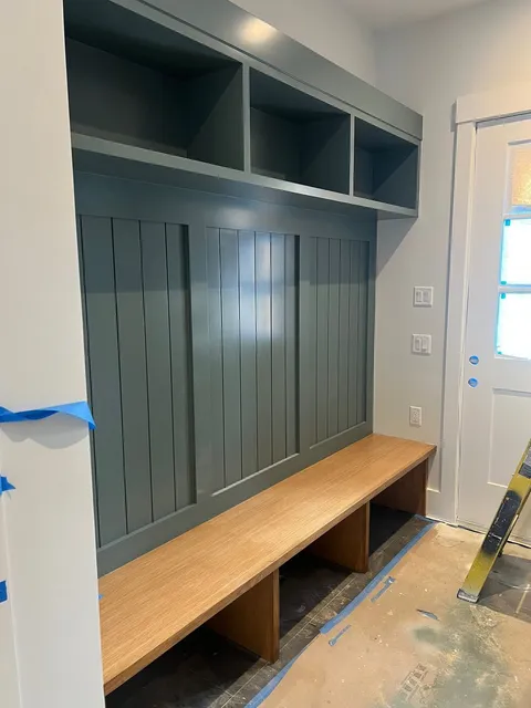 Board and batten paneling with a built-in bench and custom trim work