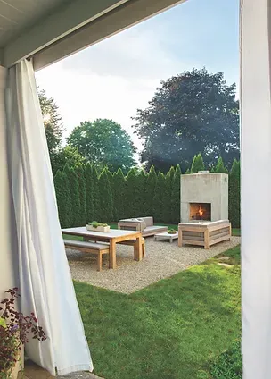 Outdoor living space with fireplace and seating