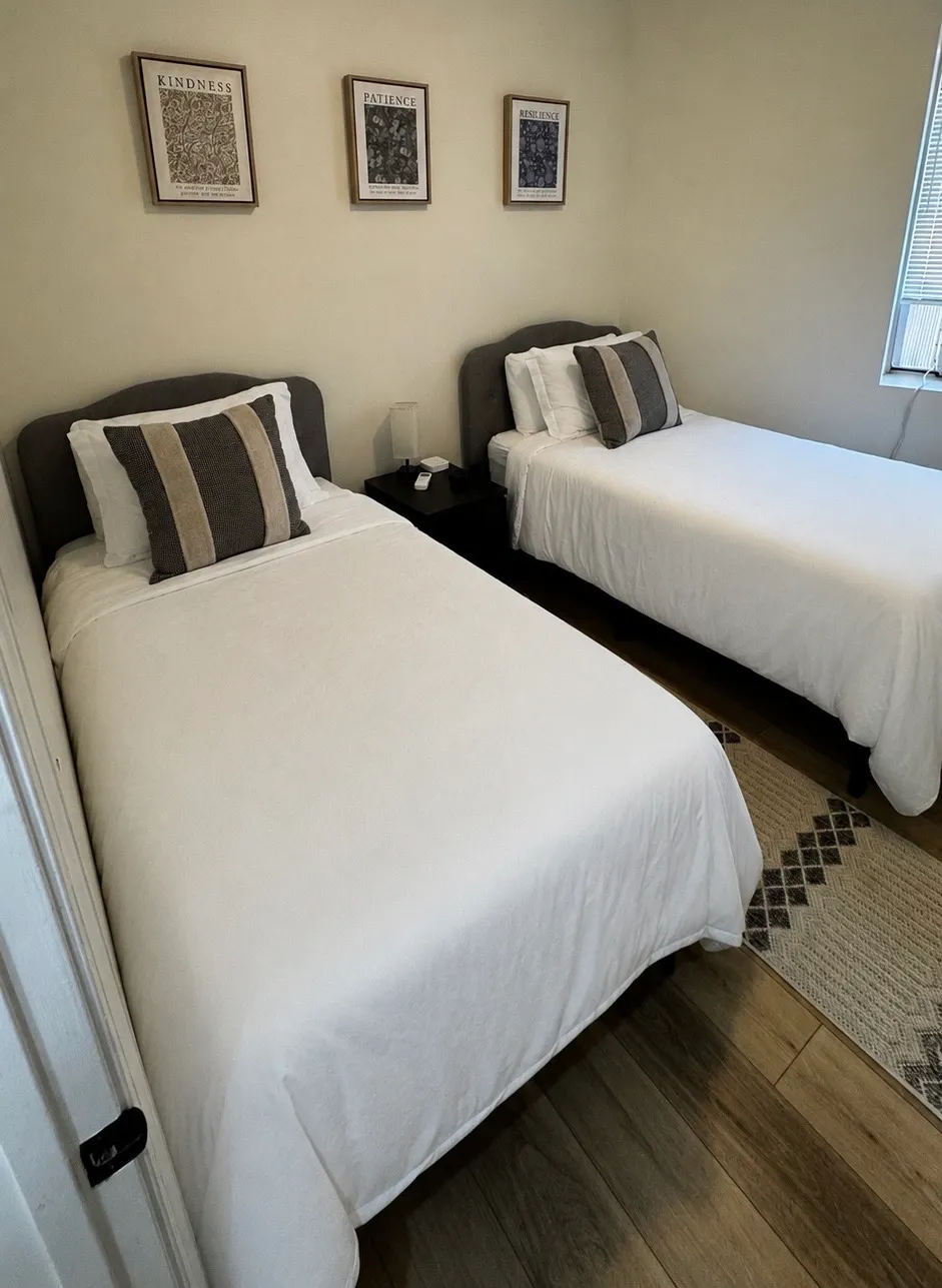 Freshly made beds prepared for Airbnb guests