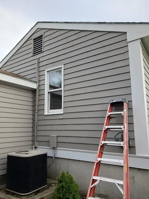 Gray exterior painting in progress in New Bedford MA - NG Painting Pro residential services