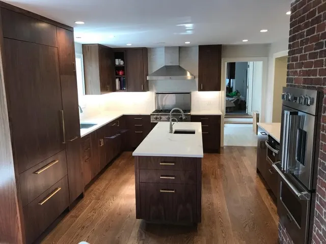 Finished custom kitchen with island and wood cabinetry