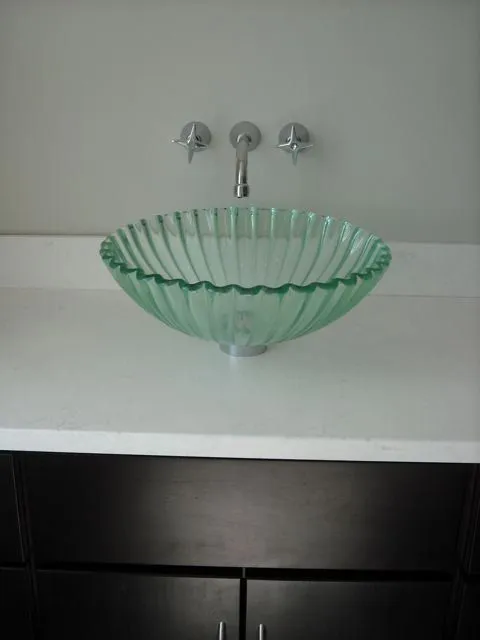 Glass vessel sink with wall-mount faucet