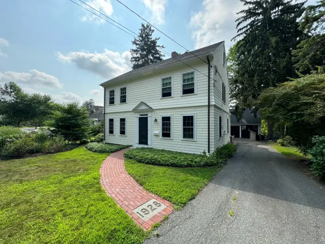 Completed white home exterior by Gallagher Painting