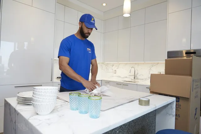 Packing kitchenware into Humboldt cartons