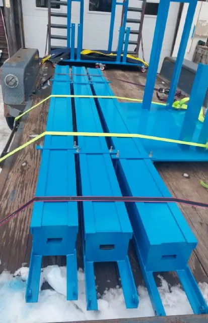 Custom fabricated blue steel components secured for delivery by Warrior Welding, specialists in structural and mobile welding