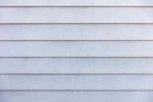 Exterior wall with new vinyl siding and trim