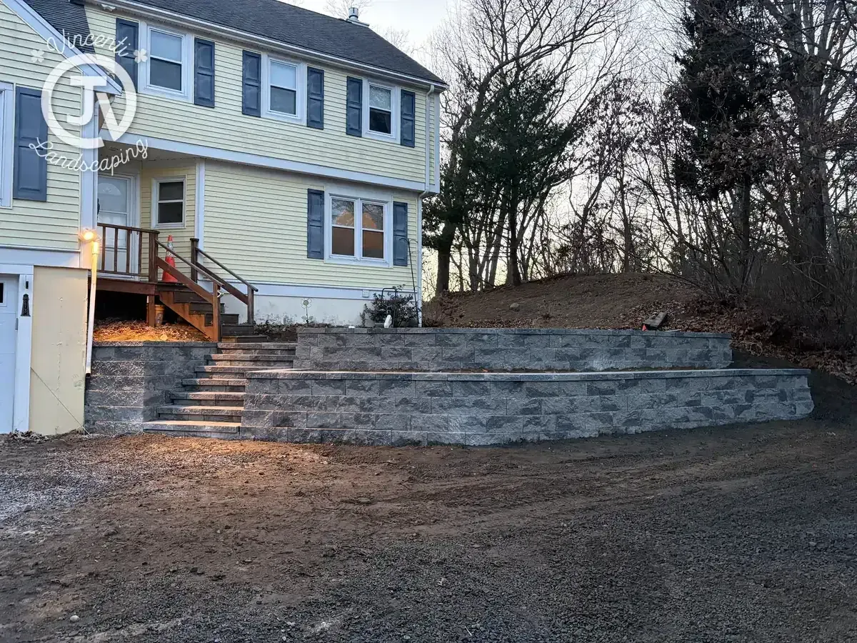 Retaining wall and stone steps installation by Vincenti Landscaping