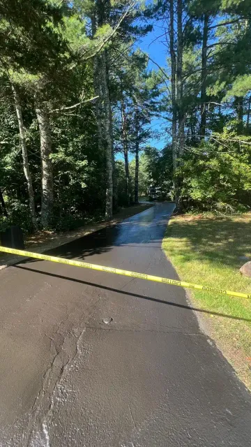Sealed asphalt lot at a Massachusetts property