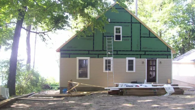 Ladder against exterior of Portland, ME home that our insulation contractors worked on.