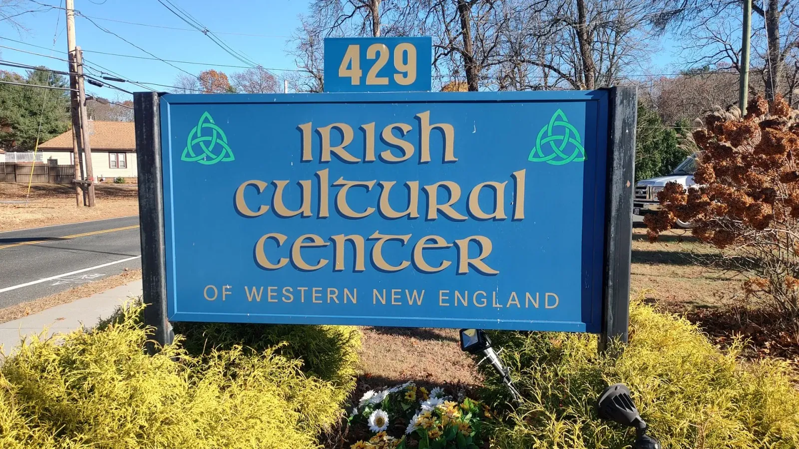 A blue sign for the irish cultural center of western new england