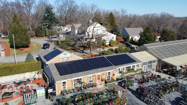 Aerial view of Sunwatt's Solar installation on the roof of Hattoy Nursery in Coventry, RI sponsored by the REF and AG Grant through the State of Rhode Island.