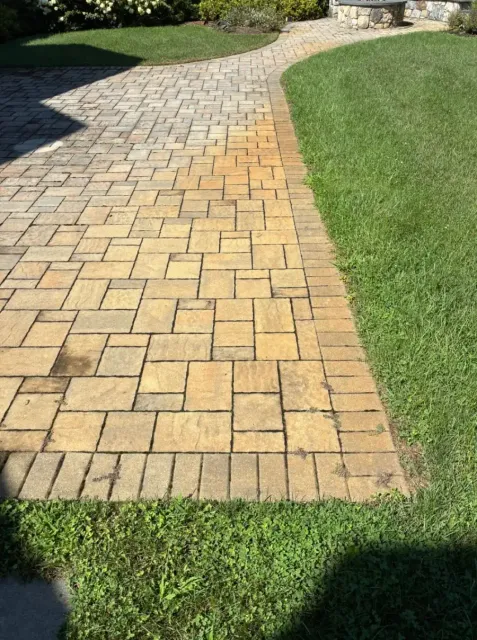 Before Irrigation Rust Stain Removal from a Paver Patio in Worcester County, MA — Pro Pressure Washing