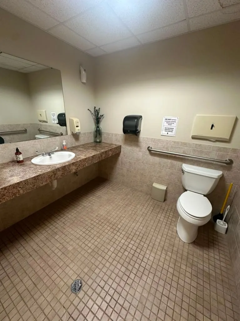 A cleaned commercial restroom with fixtures and mirrors