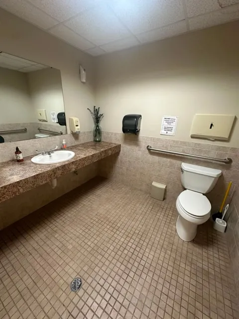 A cleaned commercial restroom with fixtures and mirrors