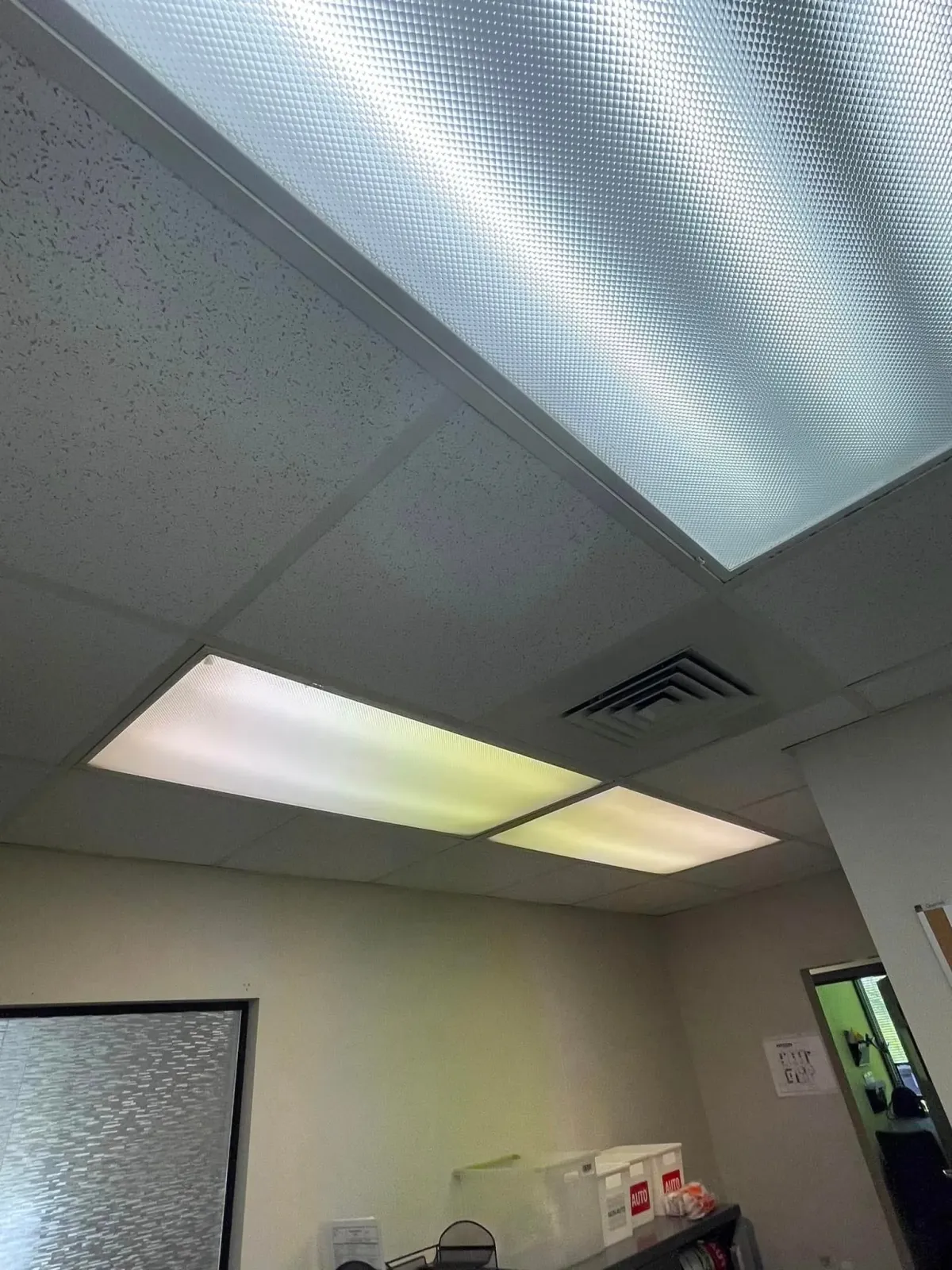 A room with a ceiling that has a lot of lights on it.