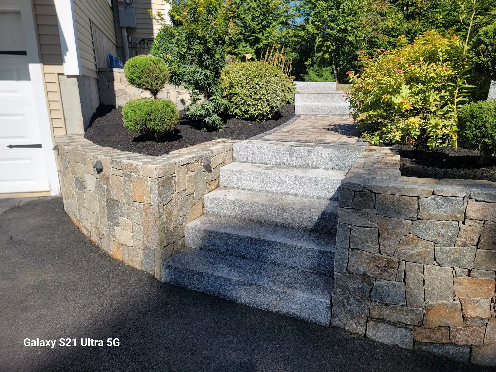 Custom stone patio built by Stiles and Sons in NH Seacoast