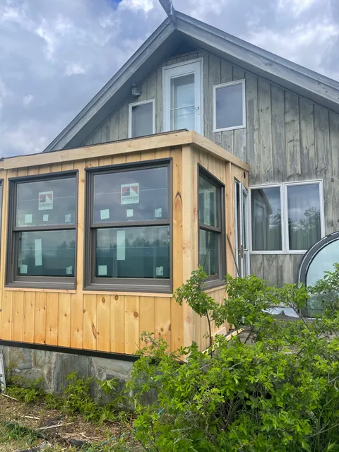 Custom wood-framed addition with Andersen windows on Vermont property