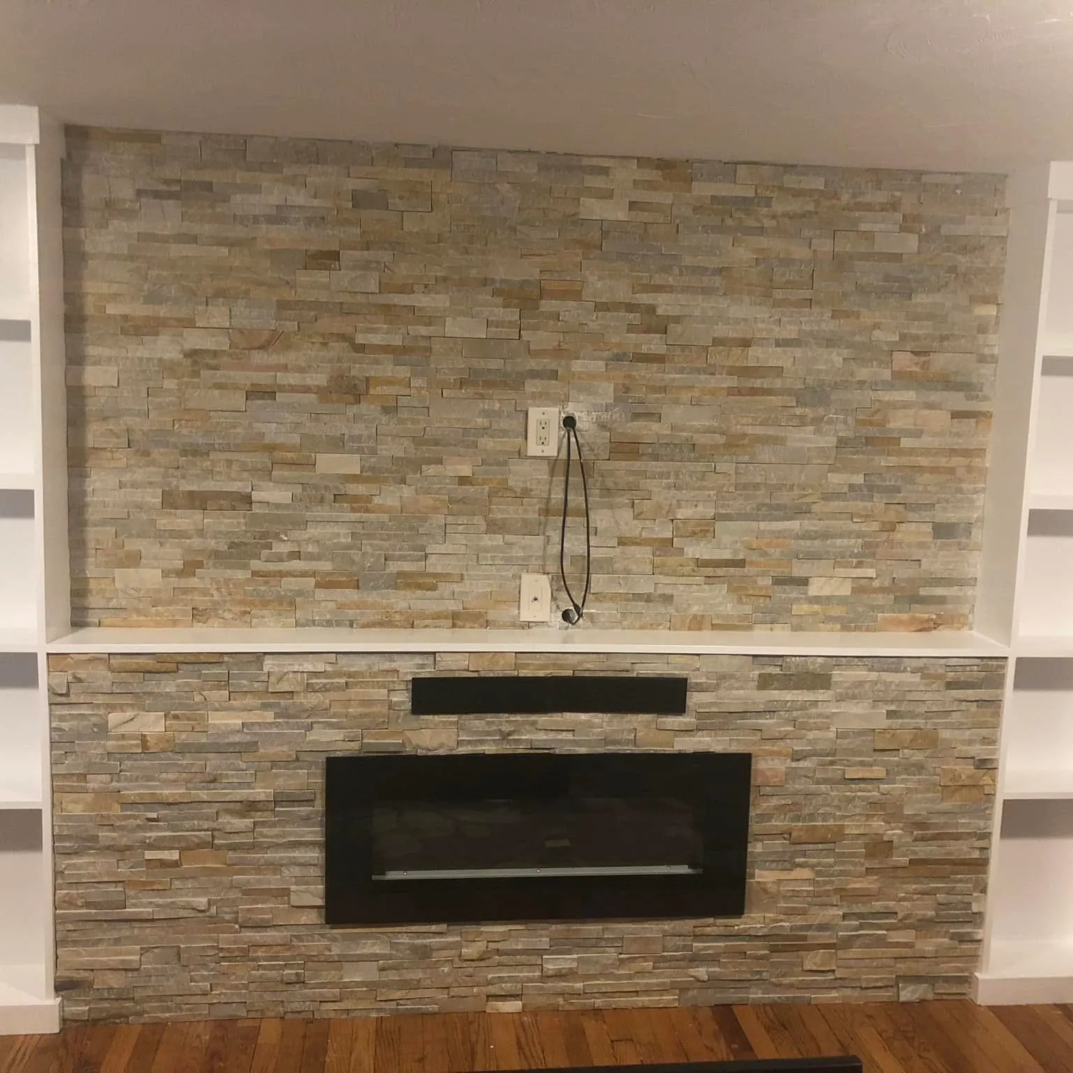 Linear mosaic tile fireplace wall